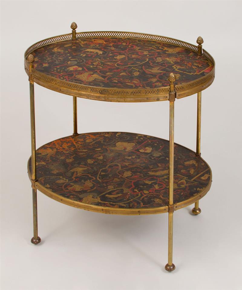 Appraisal: Brass-Mounted Leather Two-Tier Oval Table The leather embossed with Asian