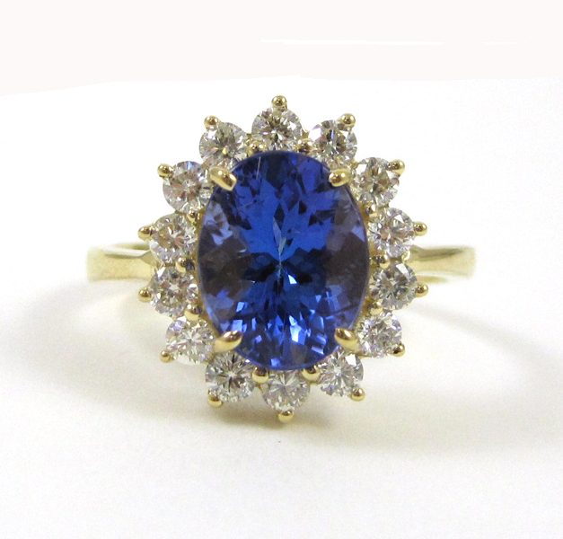 Appraisal: TANZANITE DIAMOND AND FOURTEEN KARAT GOLD RING with round brilliant-cut