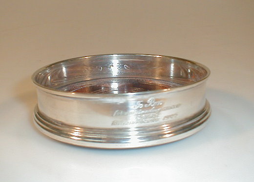 Appraisal: A modern silver and mahogany wine coaster