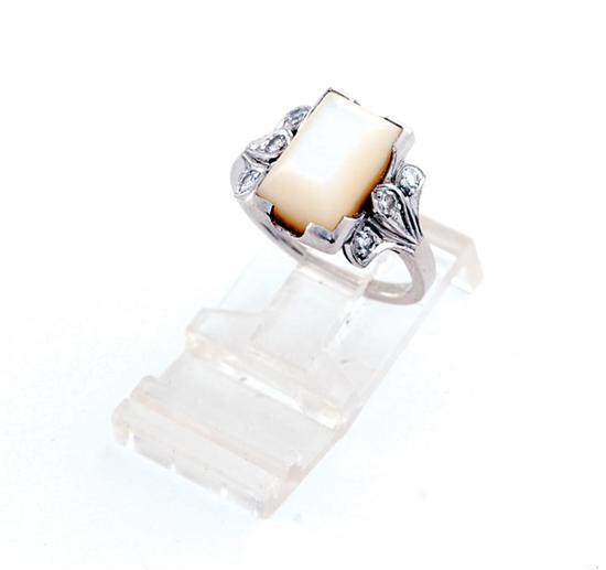 Appraisal: Mother-of-pearl and palladium ring centered by rectangular mother-of-pearl stone measuring