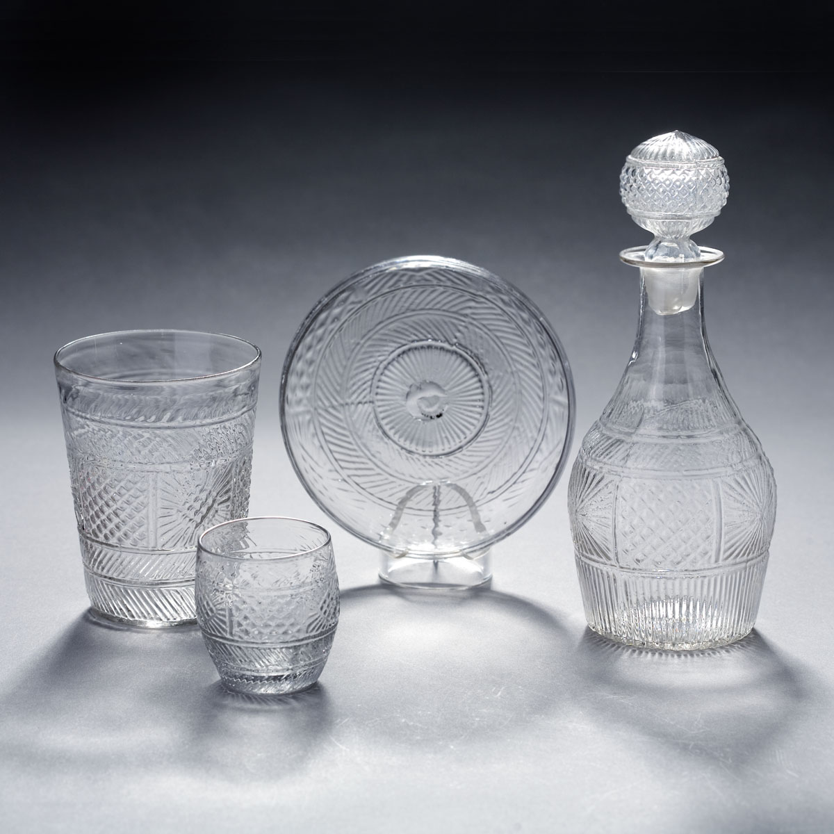 Appraisal: GROUP OF BLOWN THREE-MOLD COLORLESS 'GEOMETRIC' PATTERN TABLEWARES CIRCA -