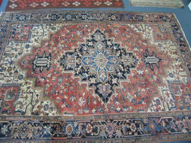 Appraisal: Heriz Persian Handmade Rug ivory blues salmon interesting geometrics '