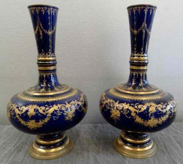 Appraisal: Pair of Bronze Mounted Blue Gilt Decorated Urns From a