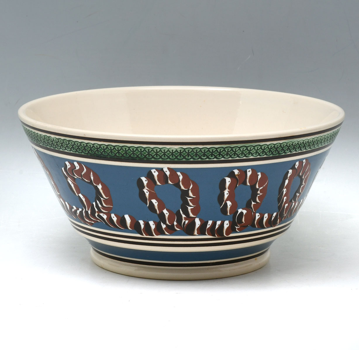 Appraisal: DON CARPENTIER MOCHA WARE BOWL Having an encompassing earthworm design