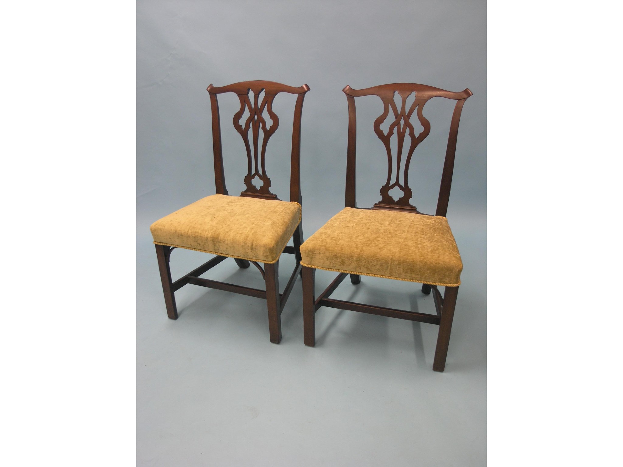 Appraisal: A pair of Victorian Chippendale mahogany dining chairs shaped top