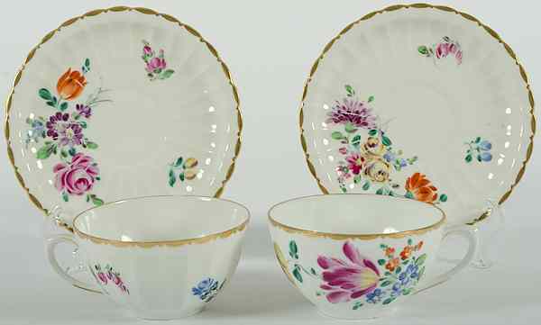 Appraisal: German Porcelain Cups and Saucers German th century two handpainted