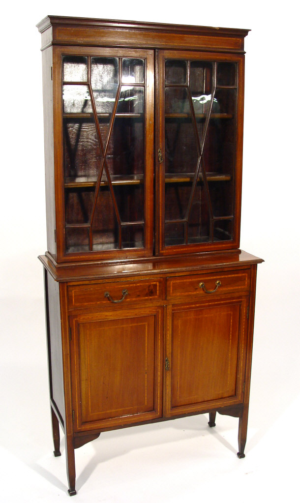 Appraisal: Edwardian inlaid mahogany bookcase with moulded cornice above a pair