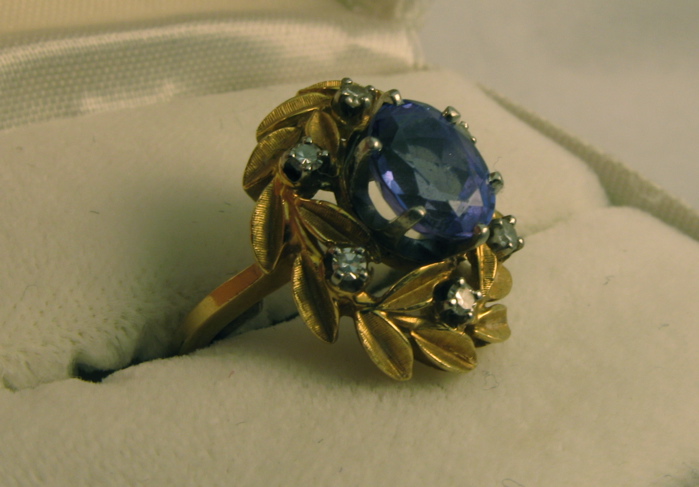 Appraisal: TANZANITE DIAMOND AND FOURTEEN KARAT GOLD RING set with a