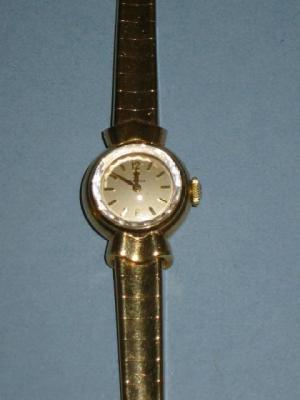 Appraisal: A LADY'S CT GOLD OMEGA WATCH the silvered circular dial