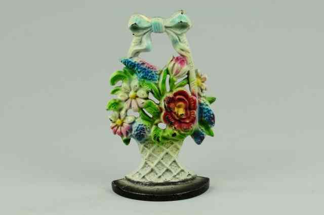 Appraisal: MIXED FLOWERS IN WOVEN BASKET DOORSTOP ''Creation Co copy ''