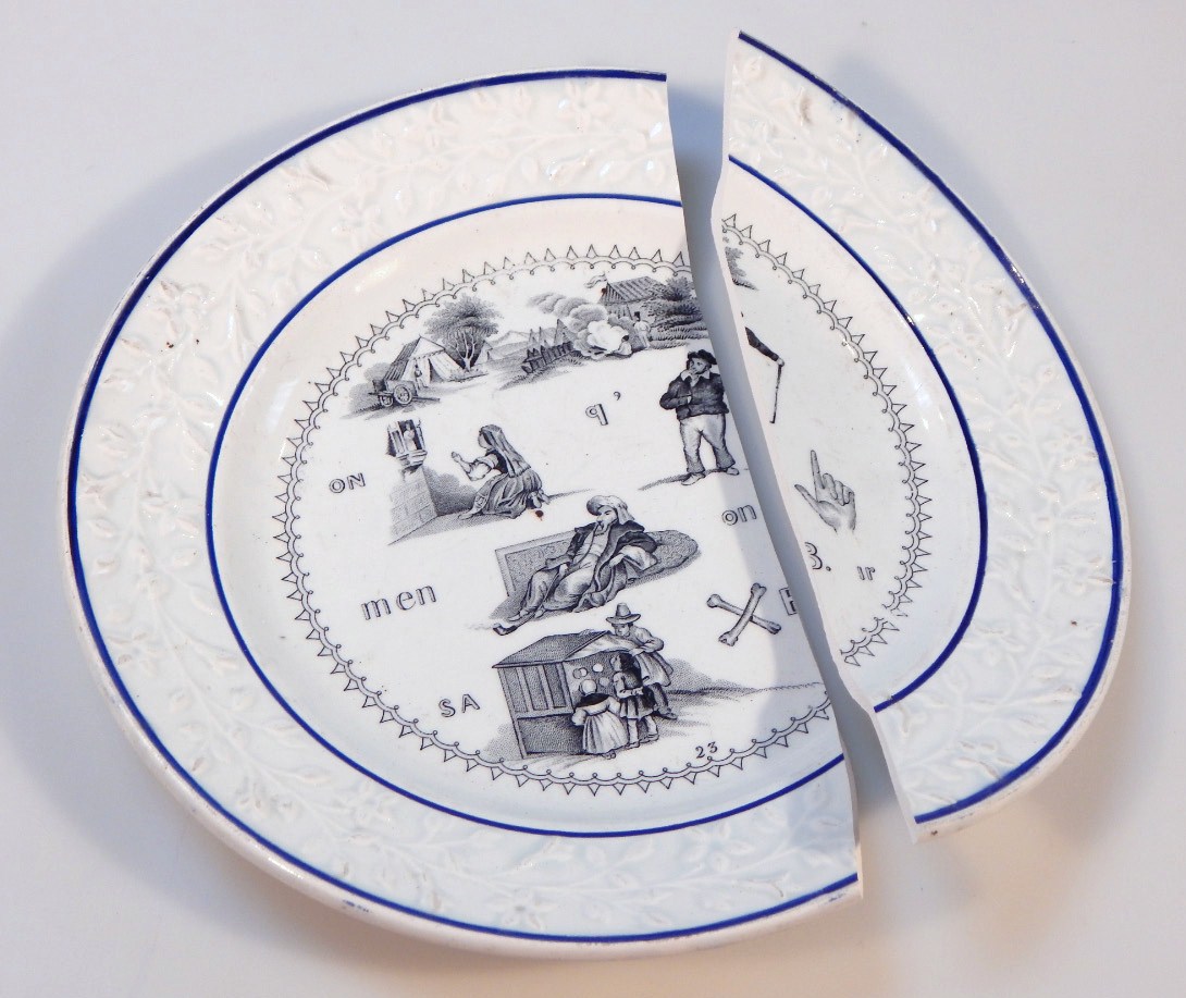 Appraisal: An early thC French Creamware motto puzzle plate with a