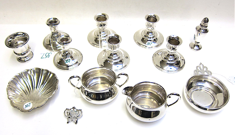 Appraisal: STERLING SILVER HOLLOWWARE AND A MONEY CLIP thirteen pieces candlesticks