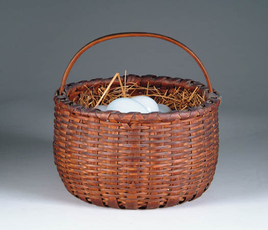 Appraisal: FINE SPLINT SINGLE HANDLED BASKET WITH GLASS EGGS Nice quality