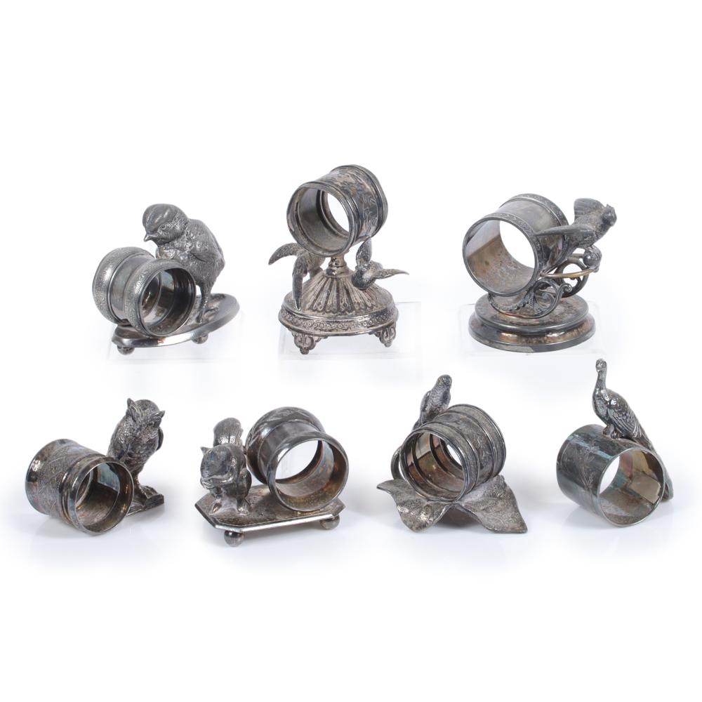 Appraisal: SEVEN VICTORIAN SILVER PLATED FIGURAL ANIMAL NAPKIN RINGS SQUIRREL PEACOCK