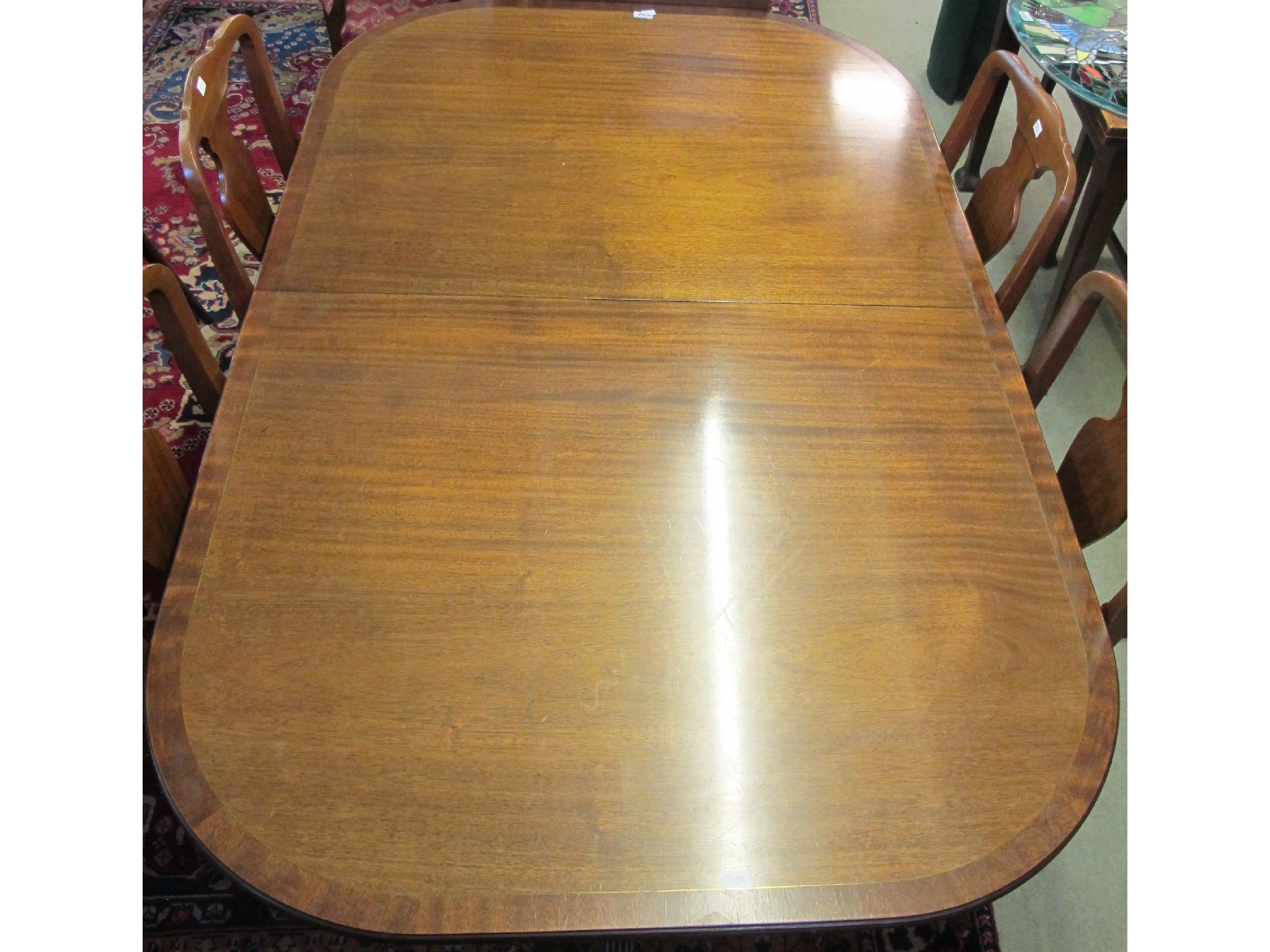 Appraisal: An extending mahogany dining table