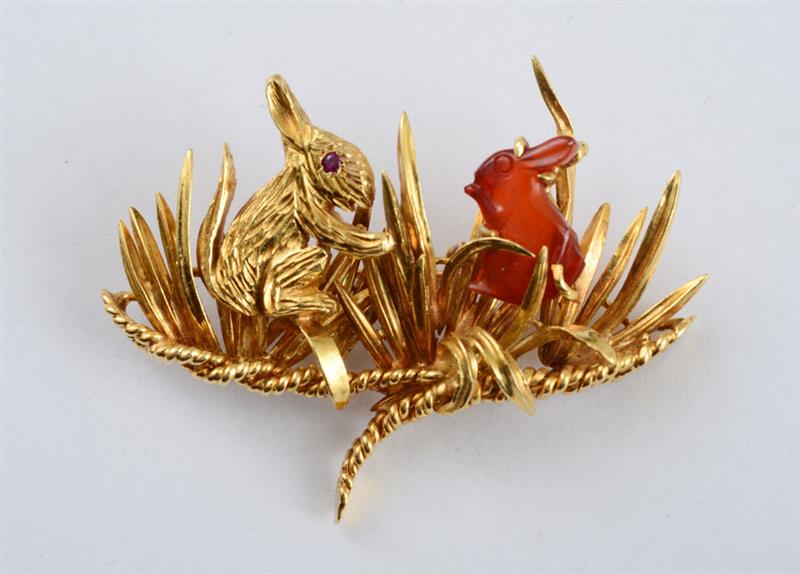 Appraisal: K GOLD AND CARNELIAN RABBIT BROOCH Posed amoung three dimensional