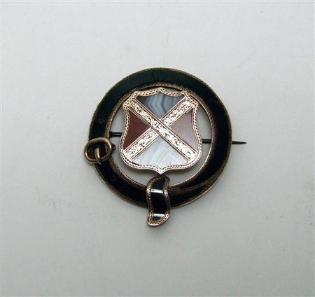 Appraisal: A Scottish pebble brooch unmarked the garter belt inlaid with