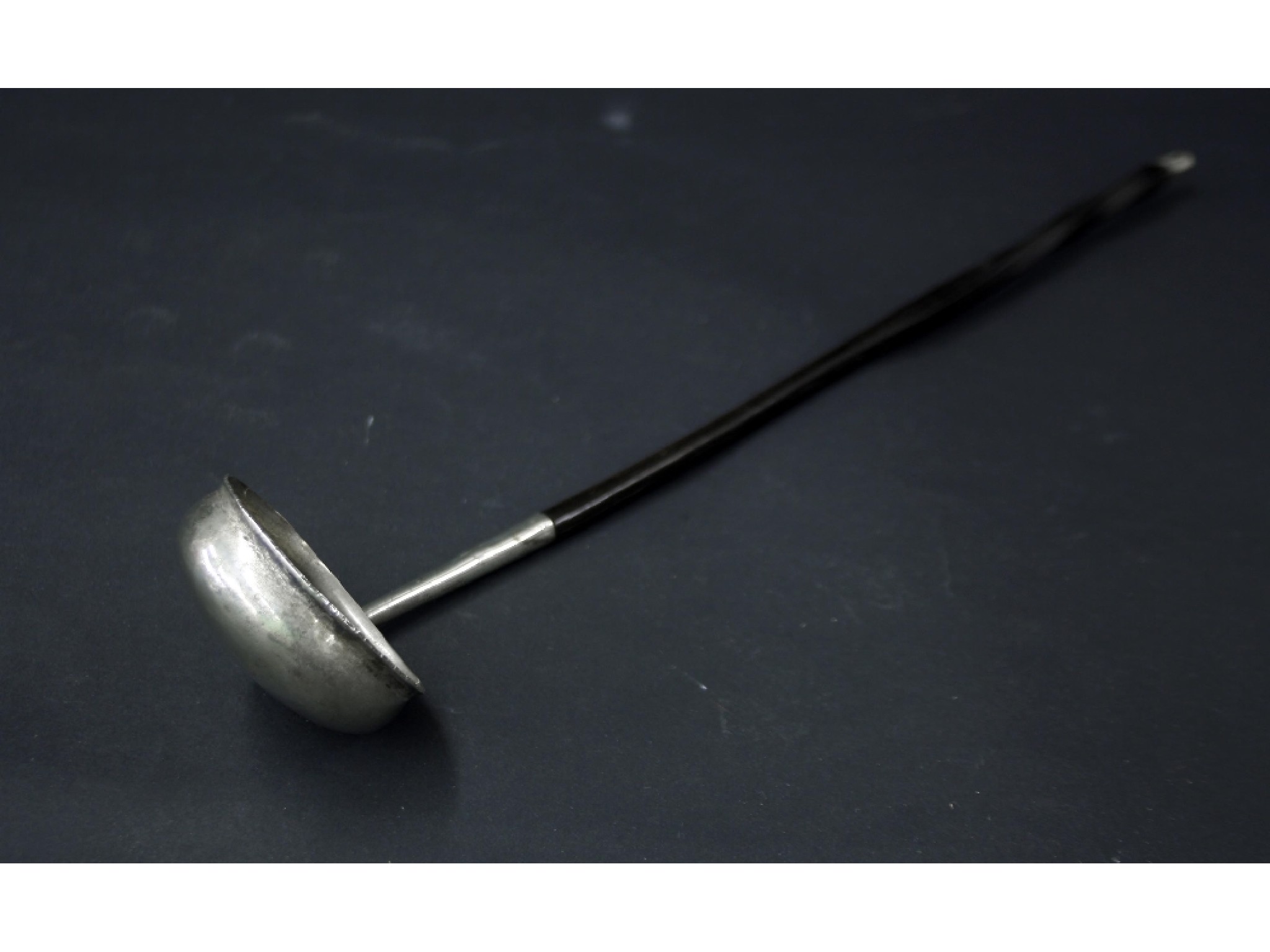 Appraisal: White metal and horn handled toddy ladle long