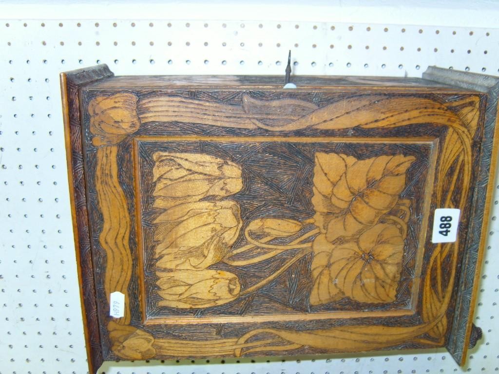 Appraisal: An early th century wall hanging cabinet with poker work