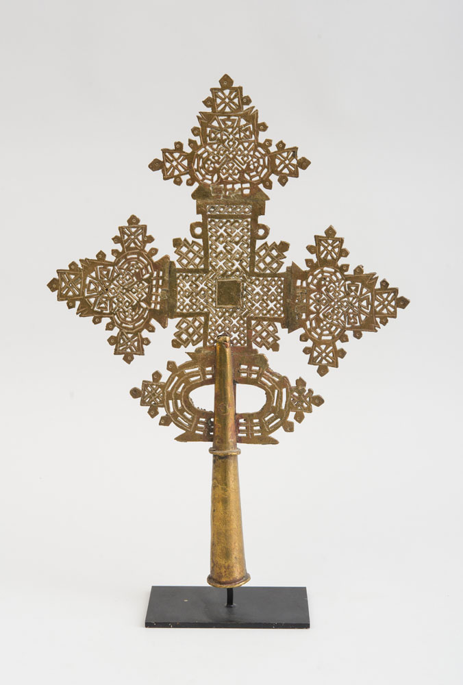 Appraisal: ETHIOPIAN COPTIC GILT-BRONZE CROSS STANDARD Now mounted on a stand