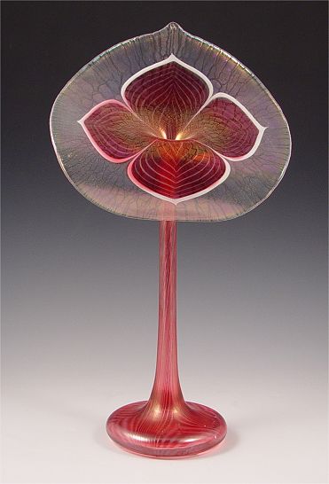 Appraisal: ABELMAN STUDIO ART GLASS VASE Iridescent cranberry pulled feather design