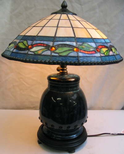 Appraisal: A TIFFANY STYLE STAINED AND LEADED GLASS LAMP two-light the