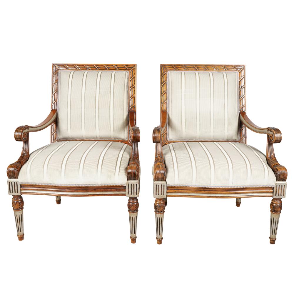 Appraisal: PAIR OF CARVED WALNUT FAUTEUILS th century with silver-painted accents