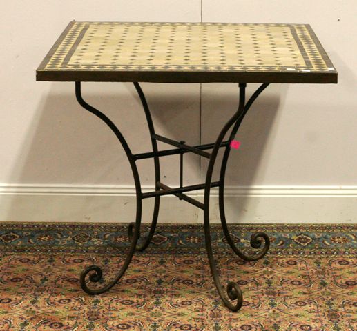 Appraisal: A Moroccan table with tiled top over a wrought iron