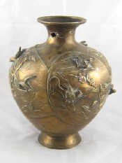 Appraisal: An antique Chinese bronze vase with raised birds amidst bamboo