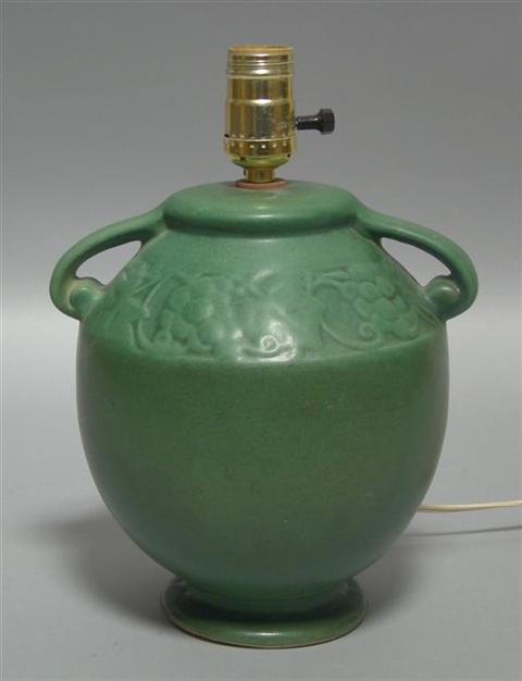 Appraisal: MATTE GREEN POTTERY LAMP BASE Possibly Hampshire ling strap handles