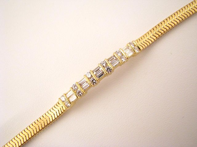 Appraisal: Gem Lok k yellow gold bracelet with center diamond bar