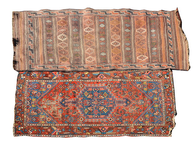 Appraisal: A HAMADHAN RUST GROUND RUG with central blue ground medallion