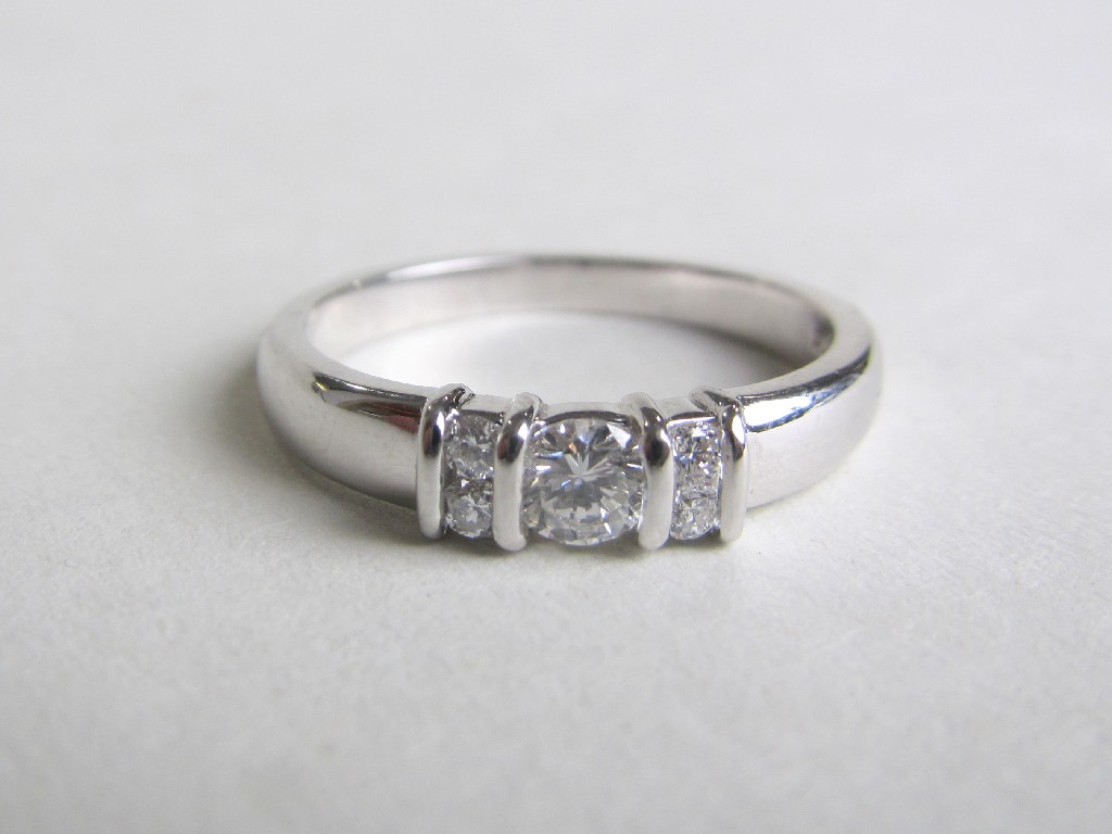 Appraisal: Platinum diamond set dress ring with central brilliant diamond flanked