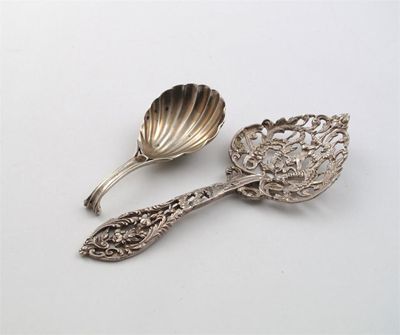 Appraisal: A George III caddy spoon with a fluted bowl and