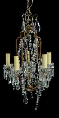 Appraisal: A Gilt Metal Chandelier with Crystals The five-candle fixture is