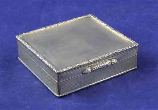 Appraisal: A 's silver square cigarette box with engine turned decoration