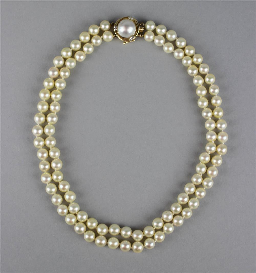 Appraisal: DOUBLE STRAND OF CULTURED PEARLS clasp marked k the two