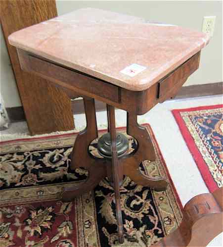 Appraisal: A PETITE VICTORIAN MARBLE-TOPPED LAMP TABLE American c having a