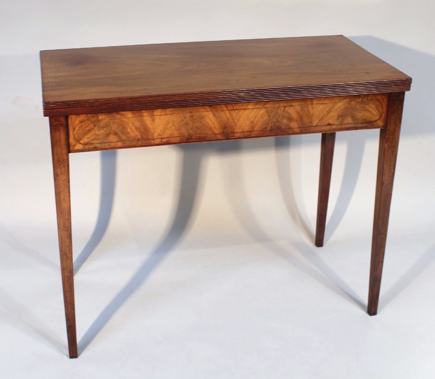 Appraisal: A thC mahogany fold over tea table the rectangular top