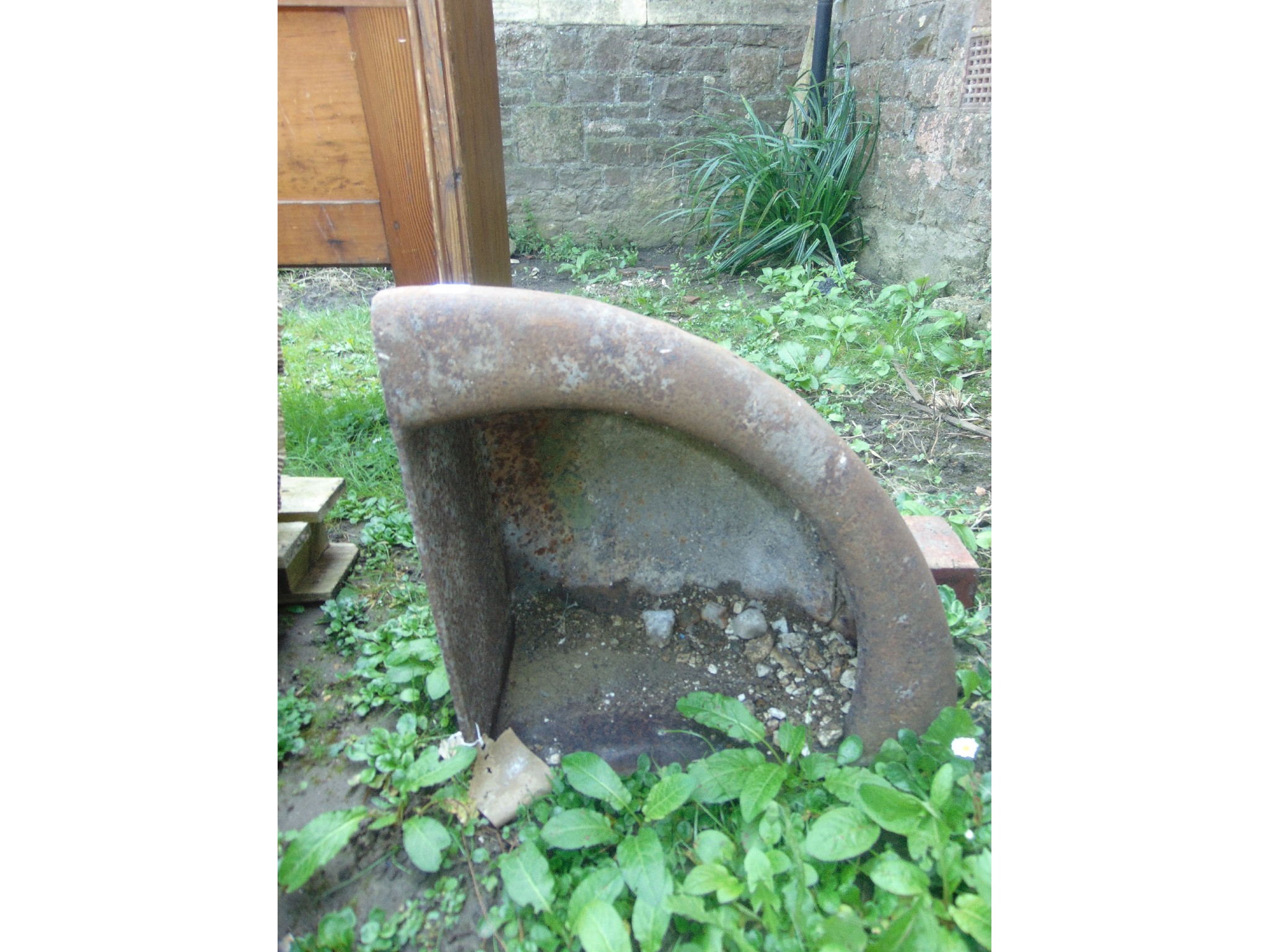 Appraisal: A small vintage cast iron wall mounted corner feeding trough