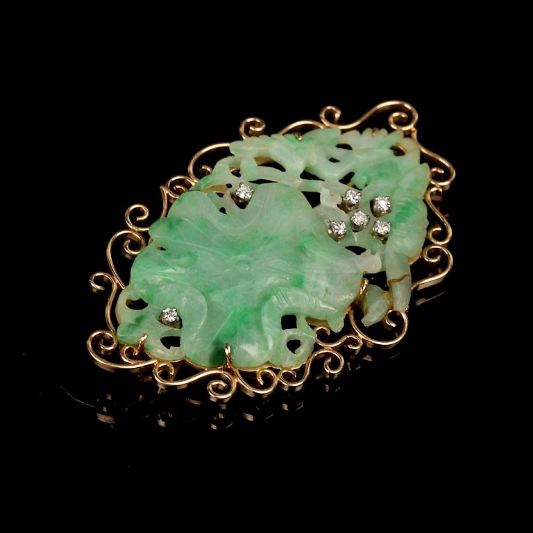 Appraisal: JADEITE AND DIAMONDS INLAID K GOLD BROOCH Carved as lotus