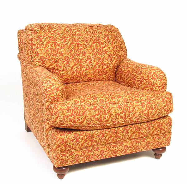 Appraisal: A fully upholstered club chair together with an ottoman height