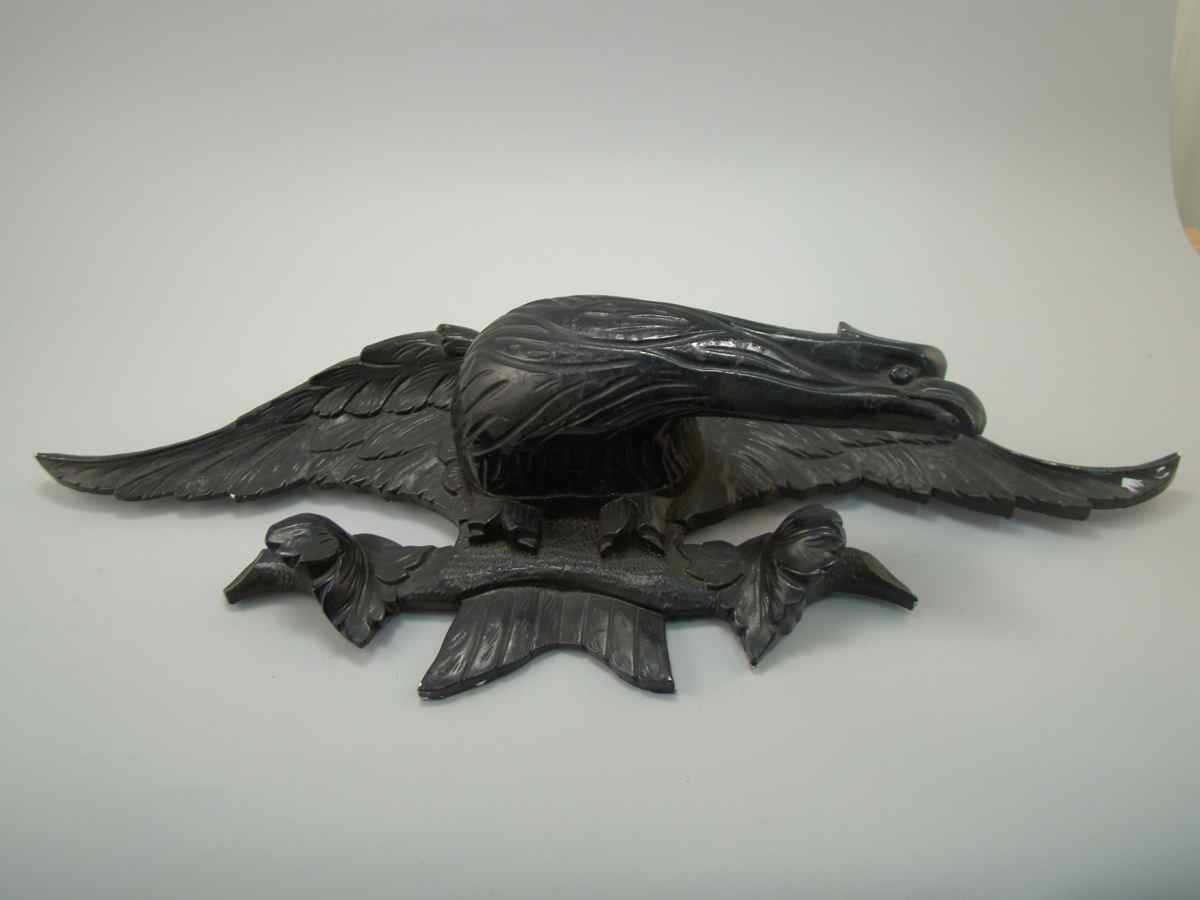 Appraisal: BLACK PAINTED CARVED EAGLE Early th CenturyWith spread wings and