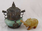 Appraisal: A jade elephant and a metalwork mounted hardstone incense burner