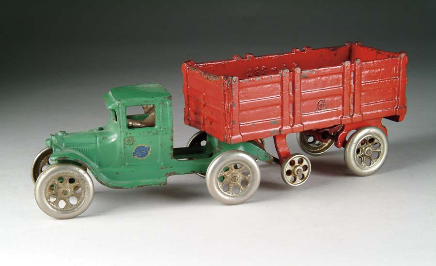 Appraisal: ARCADE TRACTOR TRAILER Green tractor with red enamel trailer with