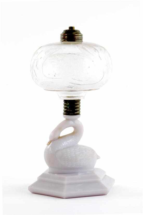 Appraisal: American glass oil lamp circa colorless glass swan-molded fluid reservoir