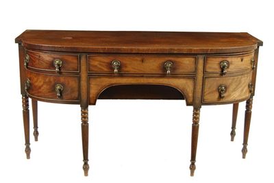 Appraisal: A late Regency mahogany barrel front sideboard with two central