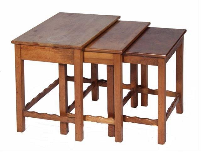 Appraisal: A NEST OF THREE COTSWOLD CRAFT WALNUT OCCASIONAL TABLES of