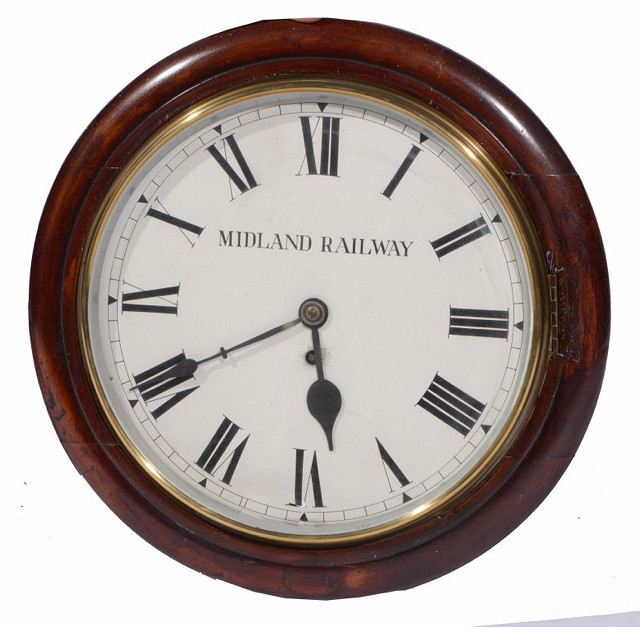 Appraisal: A MIDLAND RAILWAY VICTORIAN MAHOGANY CIRCULAR WALL CLOCK with Roman