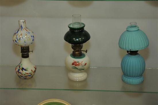 Appraisal: THREE MINIATURE LAMPS An oplescent ''end of the day'' style